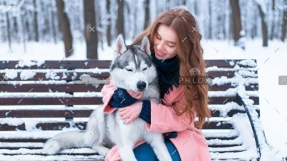 demo-attachment-38-woman-sitting-on-the-bench-with-siberian-husky-PS9ZX58